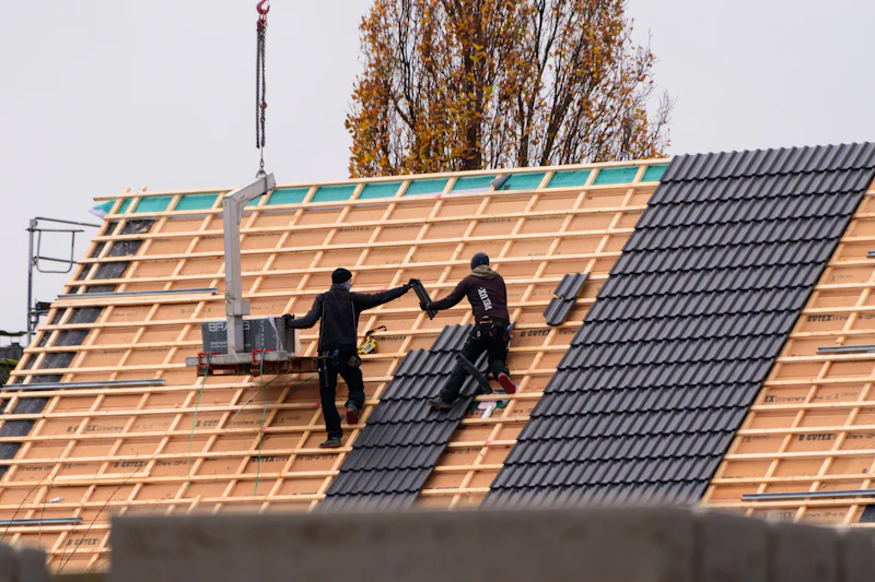 Roofers installing roof tiles